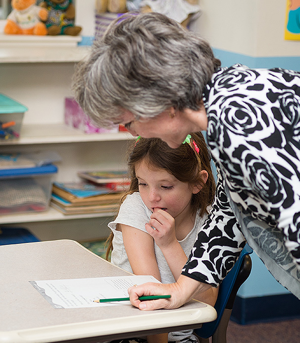 A girl student and a teacher in middle christian school