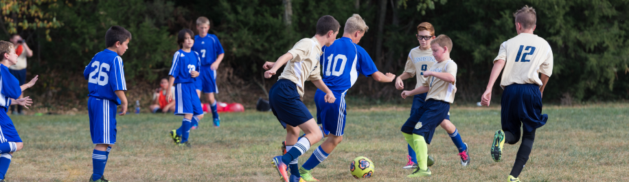 school boys playing in middle school sports