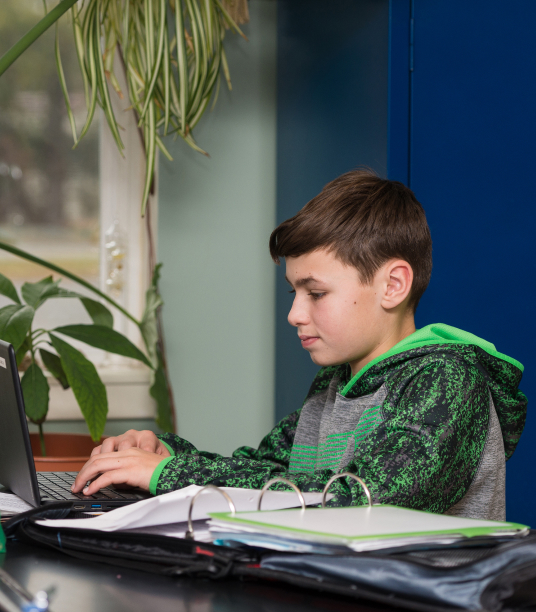 a student sitting in faith christian elementary school in VA