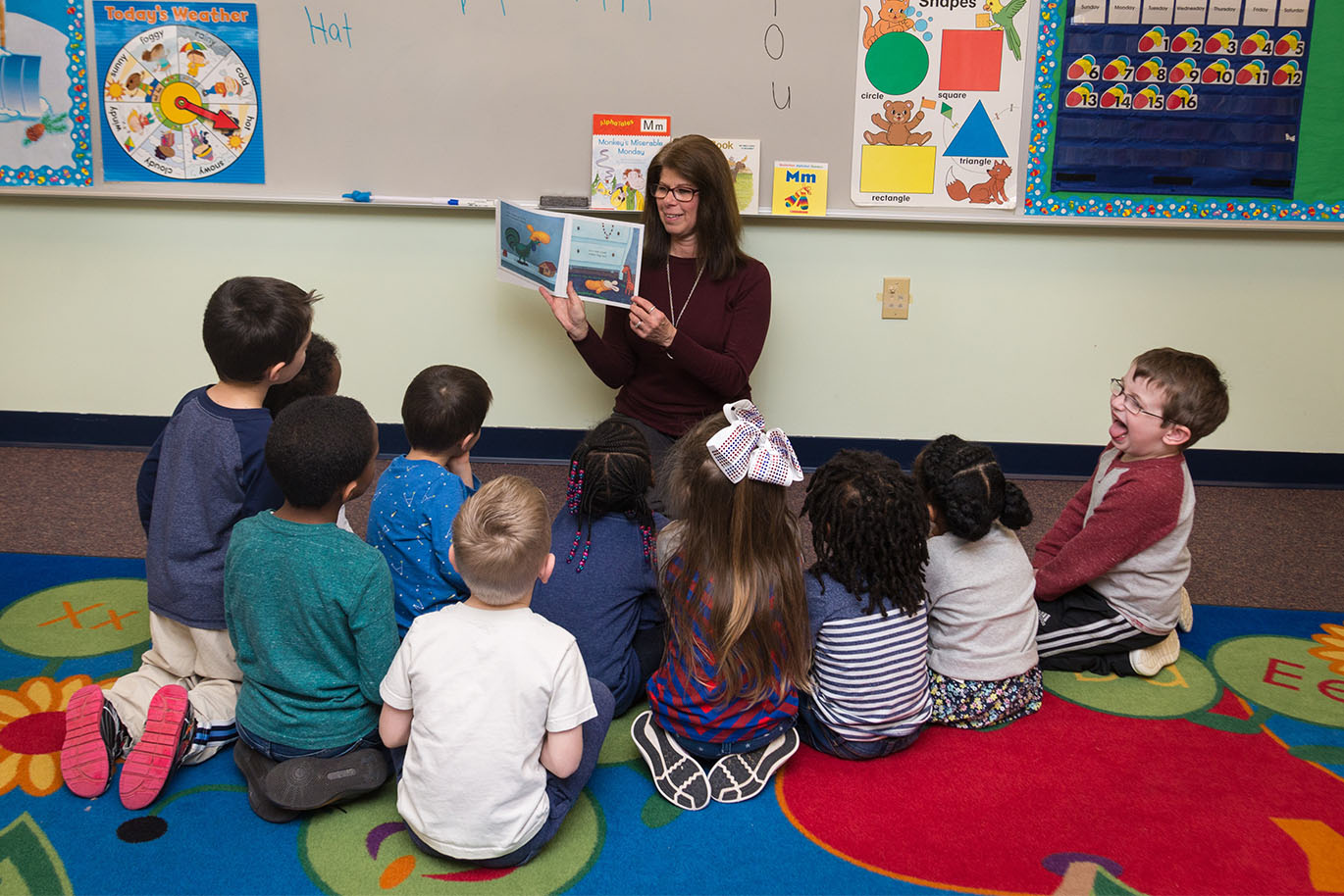 Teacher and preschool students in private christian preschool