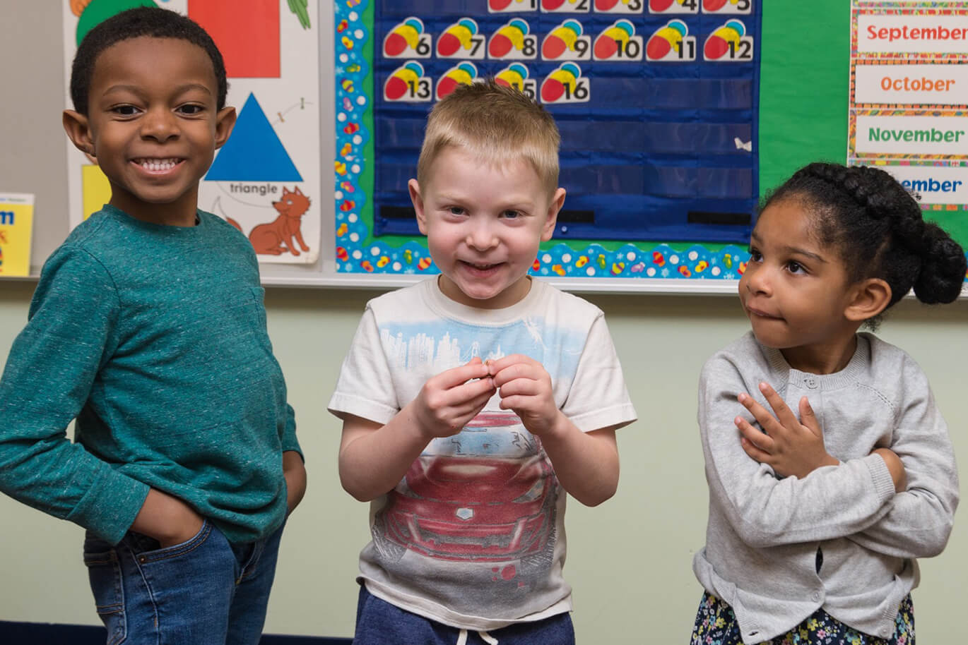 preschoolers smiling in the Cornerstone Christian Preschool in Harrisonburg, VA